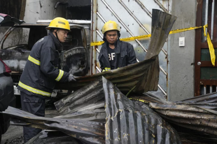 A fire kills 15 in a Philippine factory, where rains and a wrong address delayed firefighters