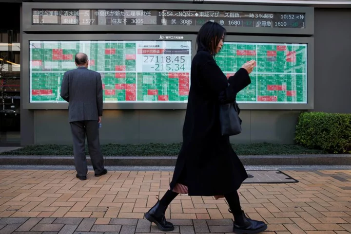 Asia stocks stall, yuan slips as China cuts rates