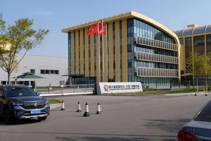 Shareholders of Evergrande's EV unit agree on restructuring deal