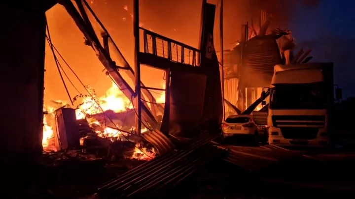 Flames rage from destroyed warehouse after Russian drone strike on Lviv