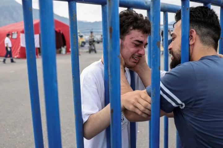 Emotional reunion amid despair as Greece searches for shipwreck survivors