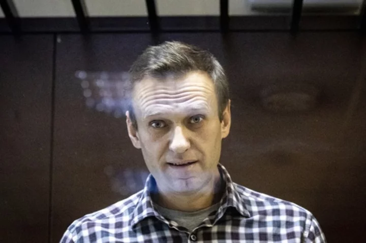 Russia jails an associate of imprisoned Kremlin foe Navalny as crackdown on dissent continues