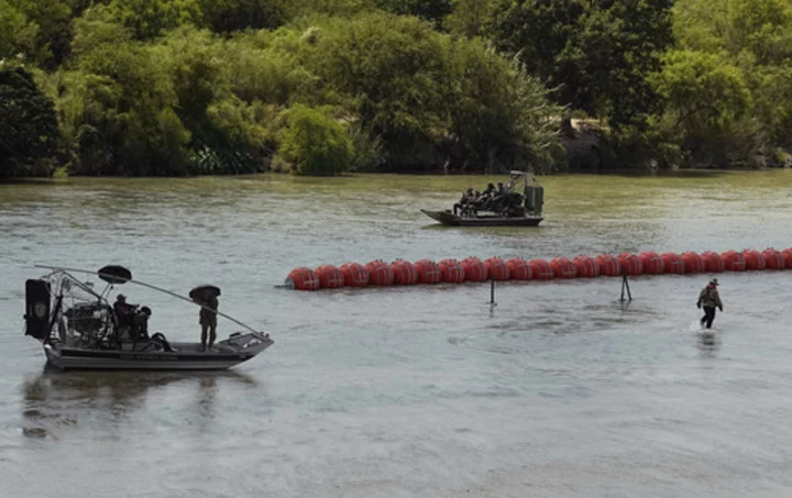 Mexico says the first body has been spotted near a floating barrier in the Rio Grande river
