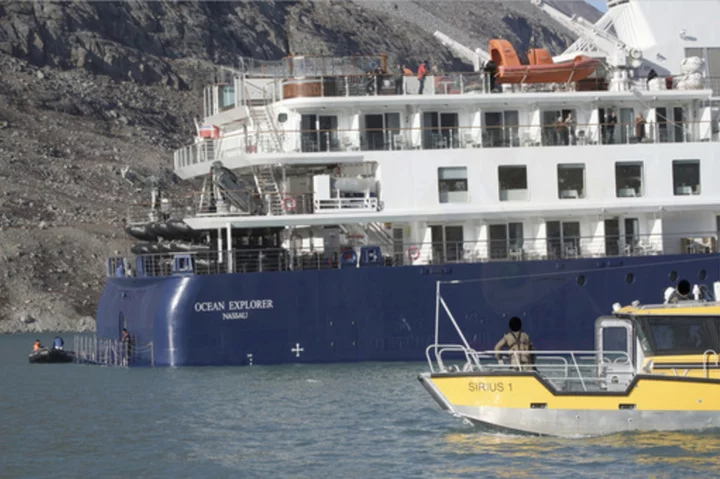 A fishing vessel in Greenland will try to free a cruise ship that ran aground with 206 people