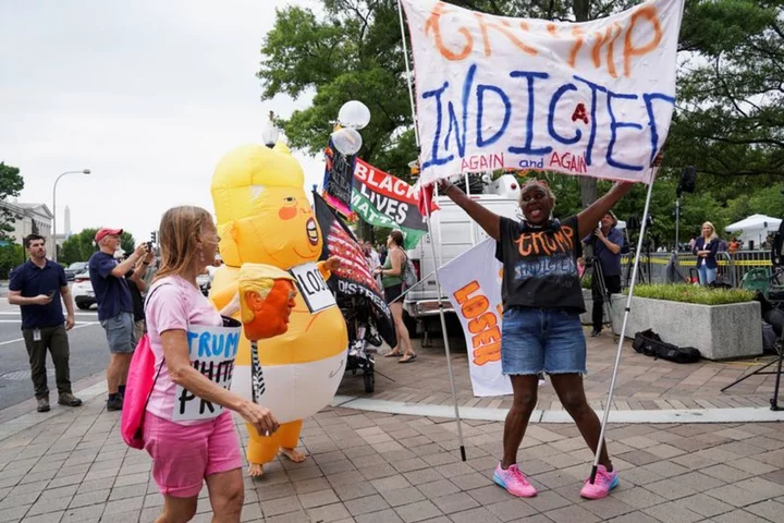 Trump's historic day in Washington court draws onlookers