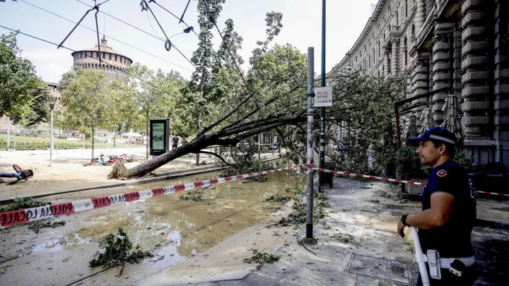 Storms ravage northern Italy as Sicily burns