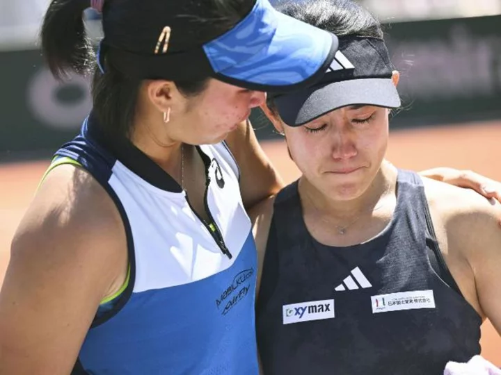 Tennis star Miyu Kato in tears as she struggles to answer questions about controversial disqualification