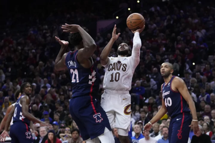 Garland leads shorthanded Cavaliers to 122-119 win over 76ers in overtime