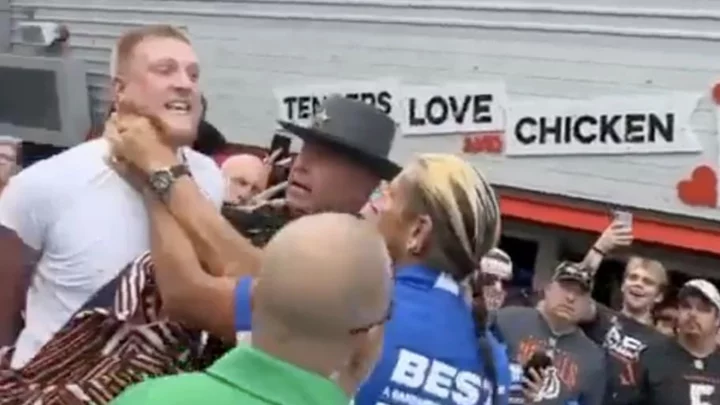 Shocking Video of a Bengals Fan, While Handcuffed and Arrested, Knocking Out Someone With a Headbutt