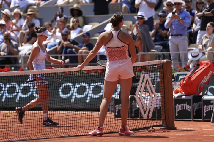 Belarus' Sabalenka waits for a handshake from Ukraine's Elina Svitolina at French Open, meets media