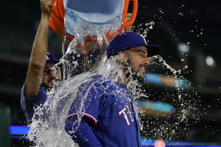 Jung homers, Heim drives in 4 to help Rangers outscore Tigers 10-6