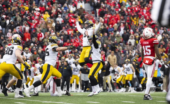 No. 21 Iowa escapes Nebraska with late interception, field goal by backup kicker