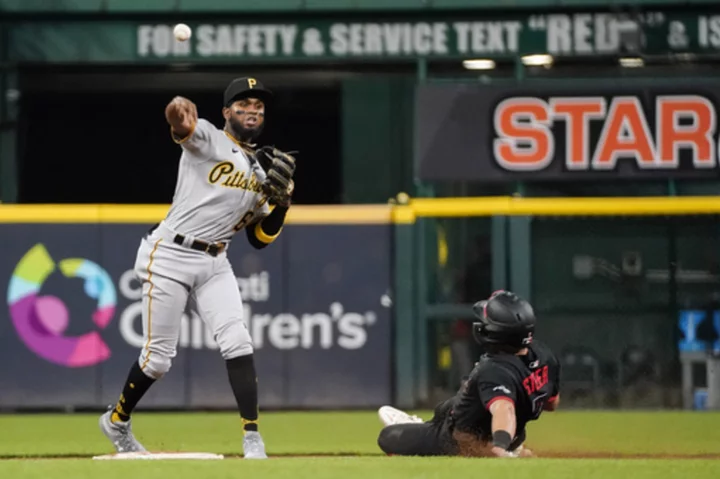 Pirates score two runs in 7th, rally to beat Reds 7-5