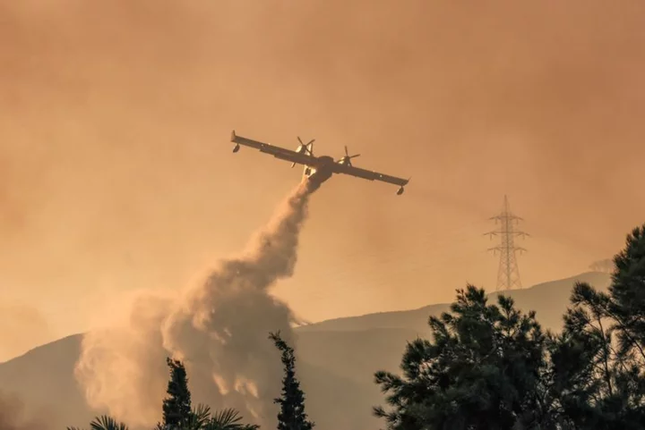 Three dead in Greece wildfires as firefighters battle the flames