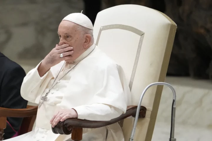 An ailing Pope Francis appears at a weekly audience but says he's not well and has aide read speech